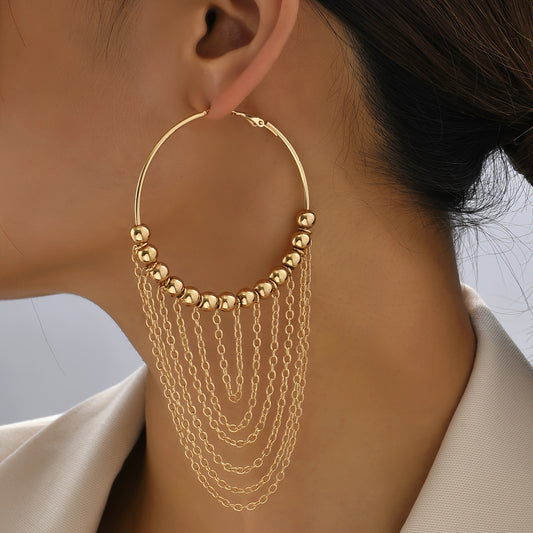 A Pair of Golden Circular Tassel Hoop Earrings