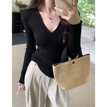 Slimming Knit Top With A Distinctive V-neck And Long Sleeves