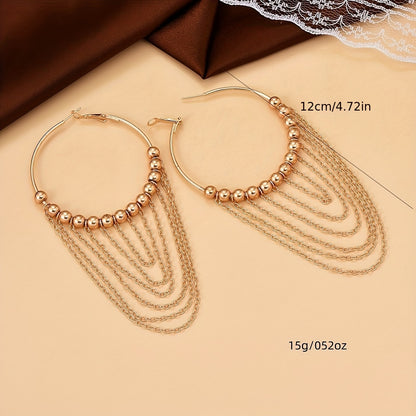 A Pair of Golden Circular Tassel Hoop Earrings