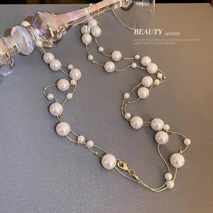 Shijiazu stacked with long pearl necklace women's light luxury temperament sweater chain Joker high sense autumn and winter necklace
