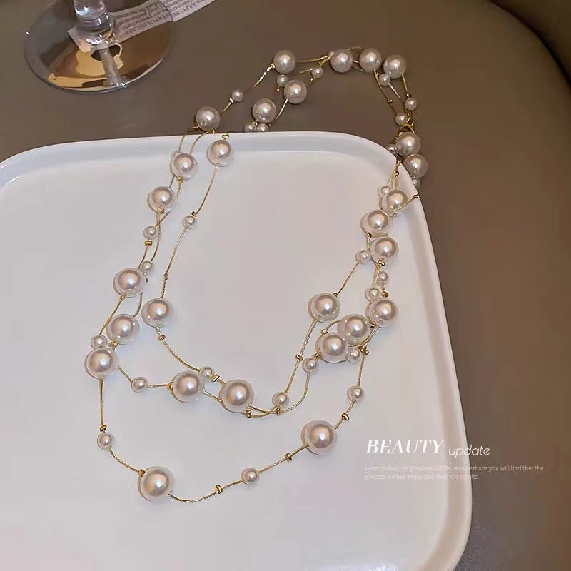 Shijiazu stacked with long pearl necklace women's light luxury temperament sweater chain Joker high sense autumn and winter necklace
