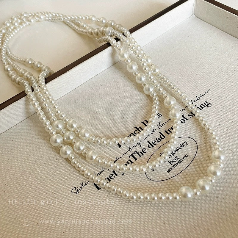 Shijiazu stacked with long pearl necklace women's light luxury temperament sweater chain Joker high sense autumn and winter necklace