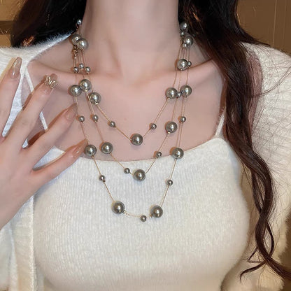 Shijiazu stacked with long pearl necklace women's light luxury temperament sweater chain Joker high sense autumn and winter necklace