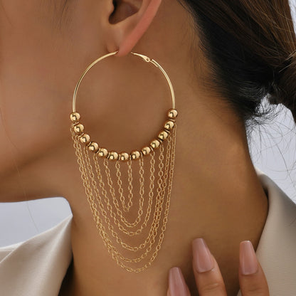 A Pair of Golden Circular Tassel Hoop Earrings